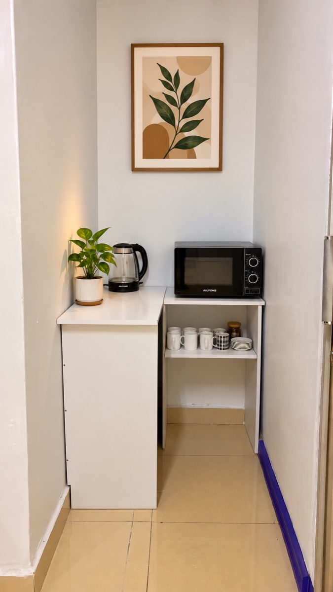 Dynamic kitchenette with a kettle, microwave and mugs